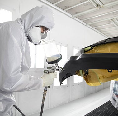 Collision Center Technician Painting a Vehicle | Romano Toyota in East Syracuse NY