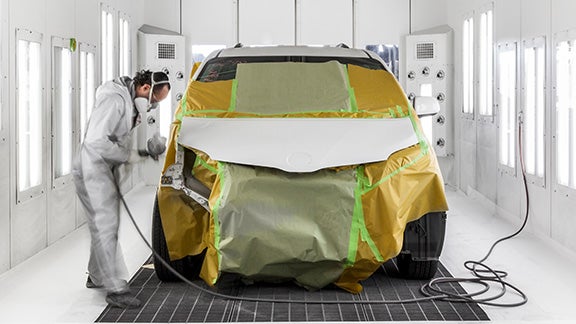 Collision Center Technician Painting a Vehicle | Romano Toyota in East Syracuse NY